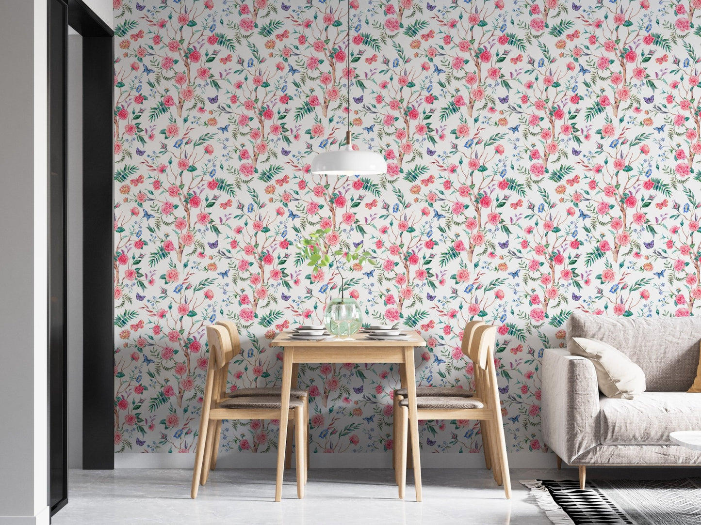 Botanical rose wallpaper in an open plan apartment with wooden dining furniture.
