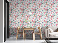 Botanical rose wallpaper in an open plan apartment with wooden dining furniture.