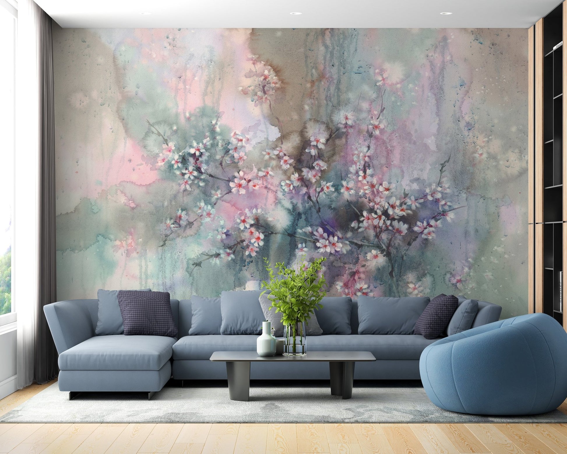 Living room sofa area accented by a Sakura Floral wall mural.