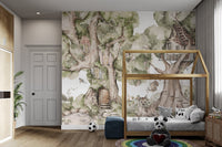 Watercolor forest wall mural with tree cottages and a playful swing.