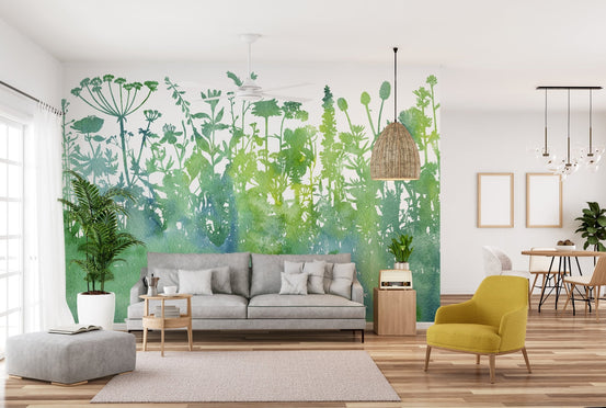 Green watercolor tree wall mural in a modern living room setting