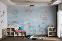 Three pastel balloons floating over grey city buildings wall mural for kids room.