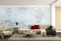 Hand-painted sky with white stars decorative wall mural in living area.