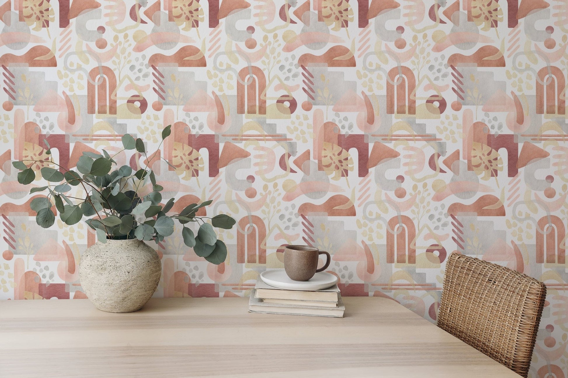 Dining area featuring a vase of flowers and warm pastel boho wallpaper.