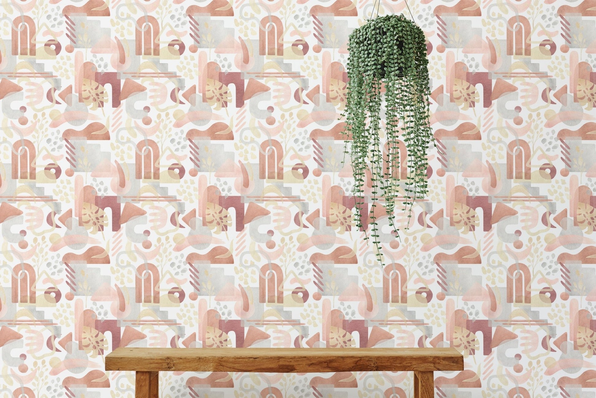 Indoor plant hanging against watercolor warm pastel colors aesthetic wallpaper.