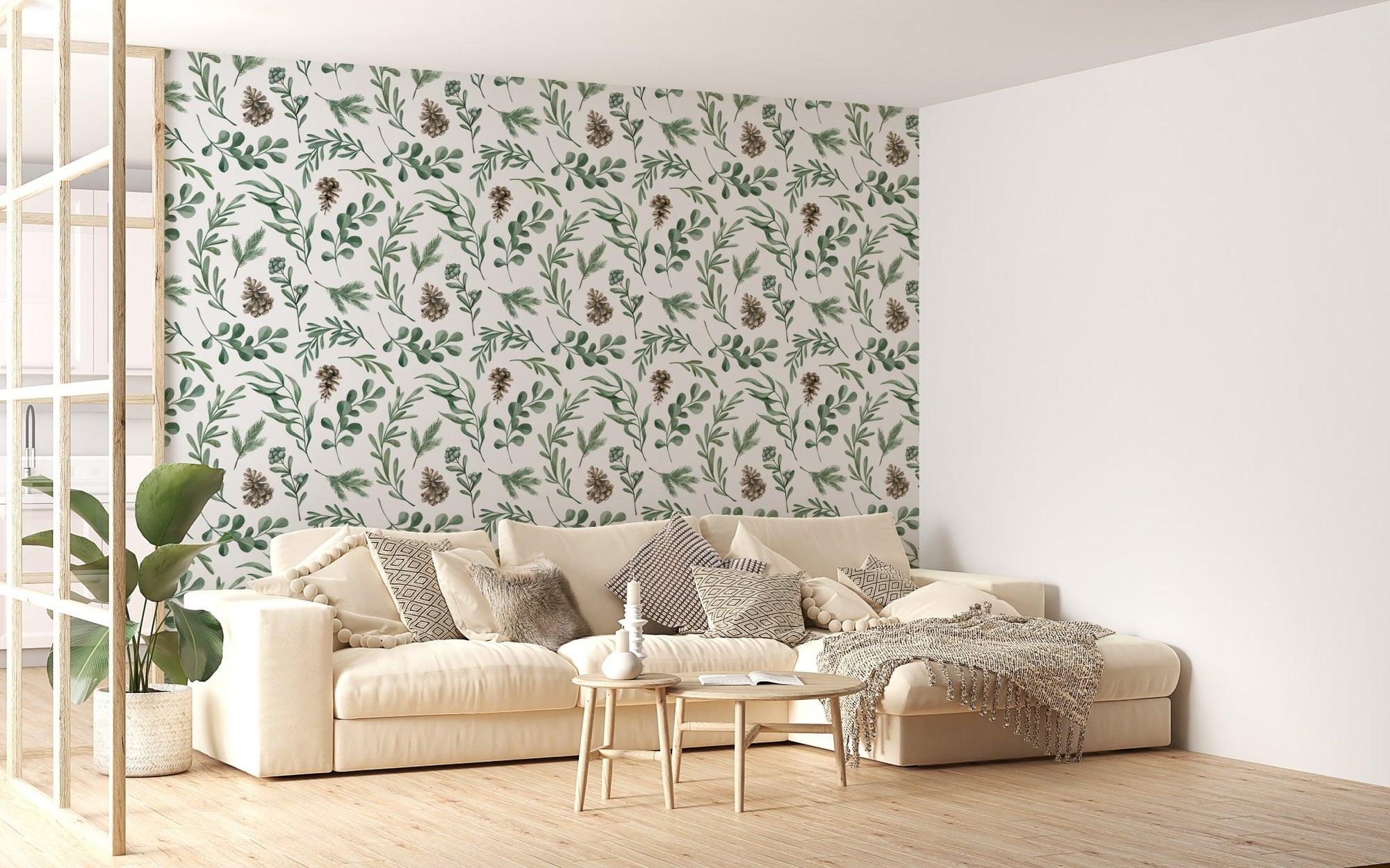 Green botanical wallpaper in a living room with a beige sofa and wooden floor.
