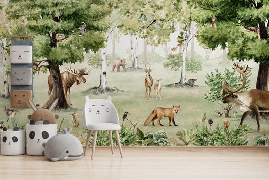 Sage green woodland wall mural with illustrated foxes and rabbits among birch trees.