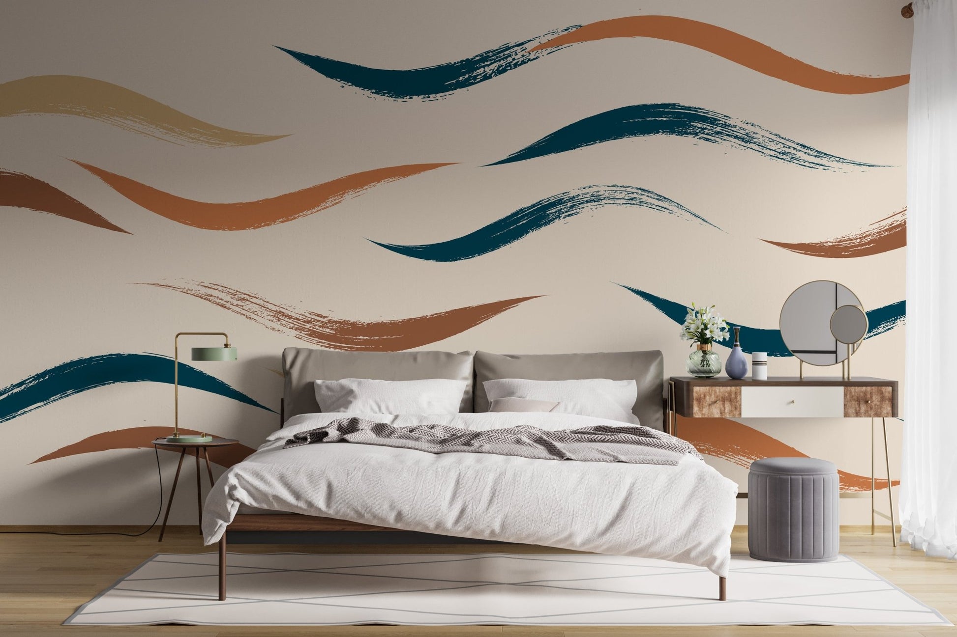 Grey bed set against a beige wall mural with abstract wave patterns.