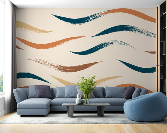 Teal and terracotta wavy pattern mural on a living room wall with blue sofa.