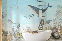 Whale encounter wall mural in pastel ocean color palette.