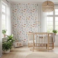 Colorful cartoon vehicles on a white wall mural.