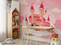 Cartoon castle wall mural in a study area with a wooden desk and white chair.