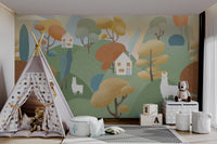 Children’s playroom wall mural with llamas, rolling hills and cozy houses.