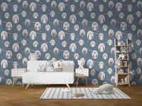 Kids' play area featuring owl print wallpaper and white storage cabinets with toys.