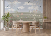 Whimsical animal meadow wallpaper with birds flying over soft hills for dining room.