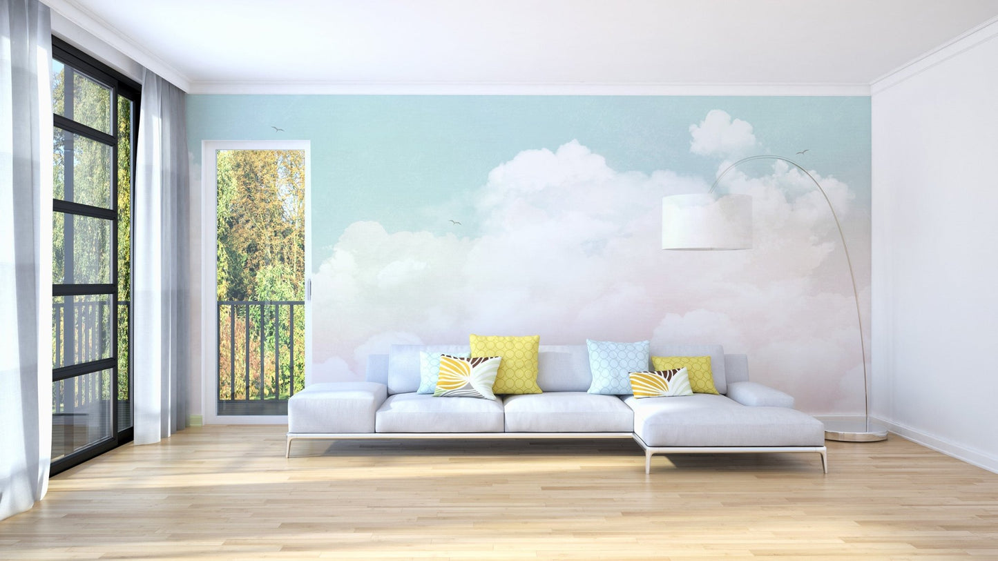 Pastel cloudscape wall mural in blush and aqua tones.