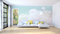 Pastel cloudscape wall mural in blush and aqua tones.