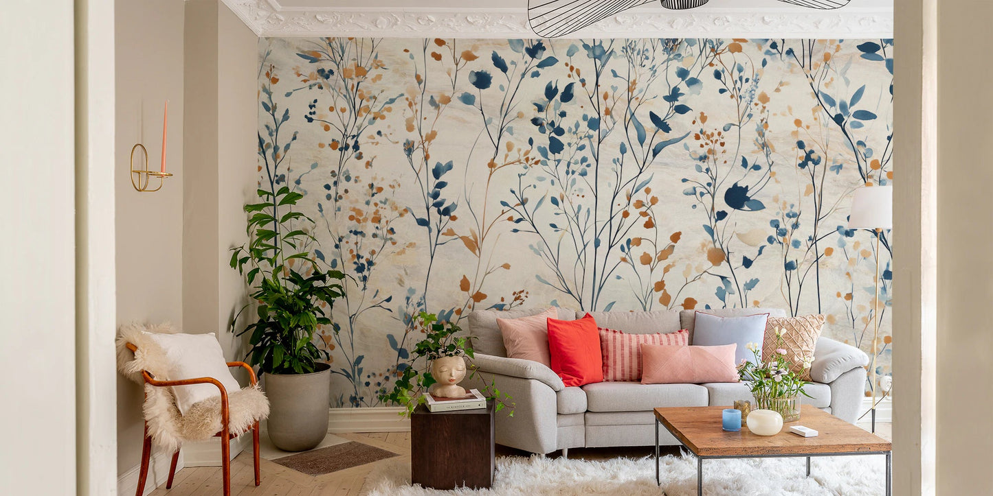 Spacious living area with white furniture and botanical meadow pattern wall mural.