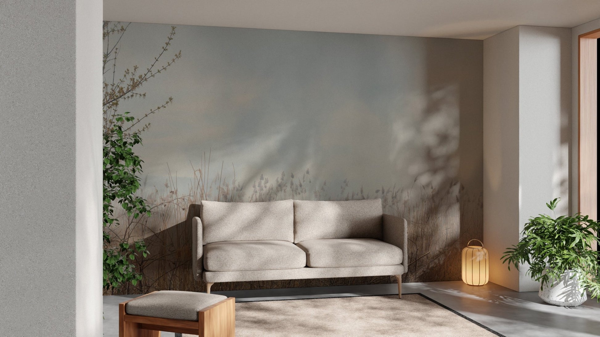Neutral tone reeds wall mural behind a grey sofa in a sunlit living room.