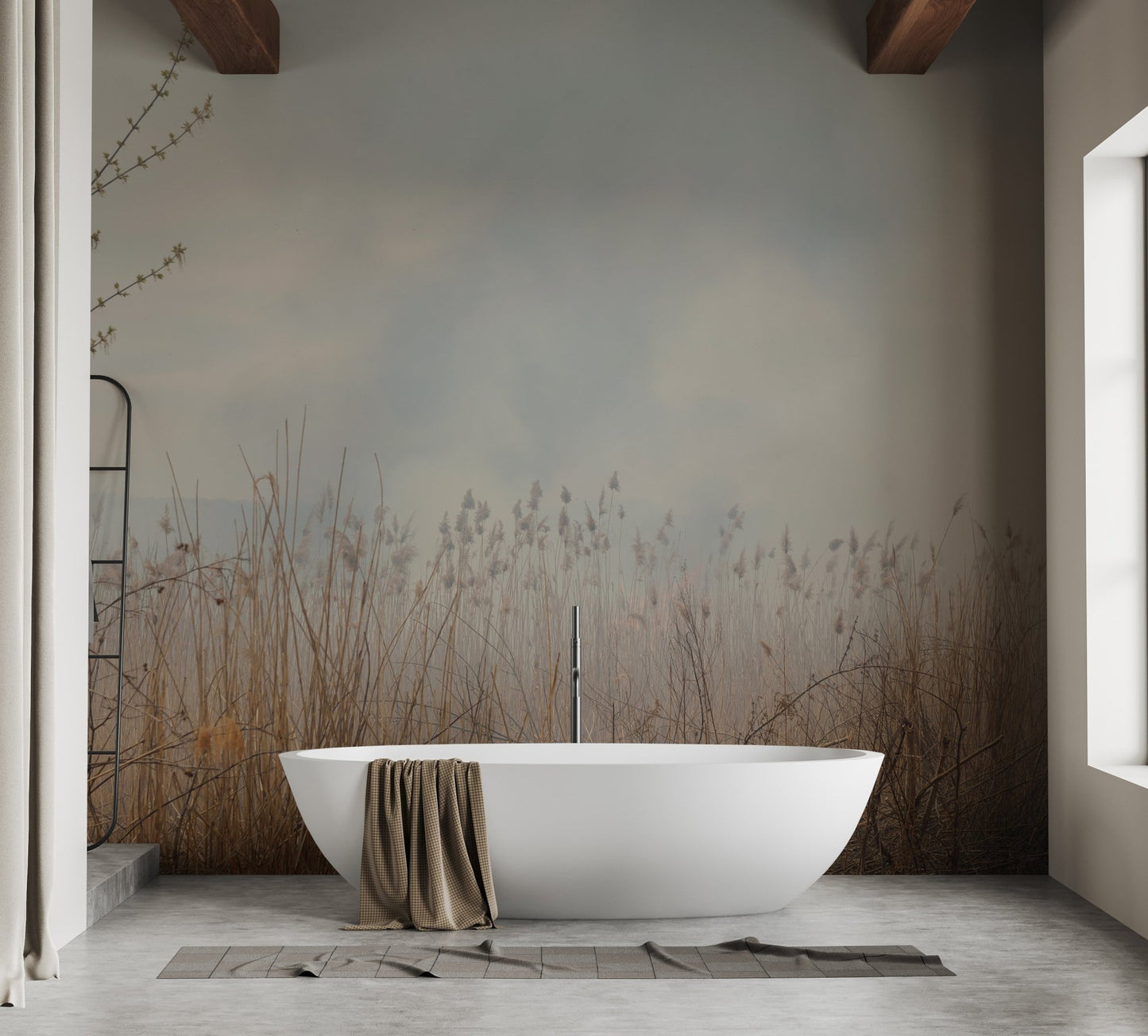 Soaking tub in a rustic bathroom with tall reeds mural on the feature wall.