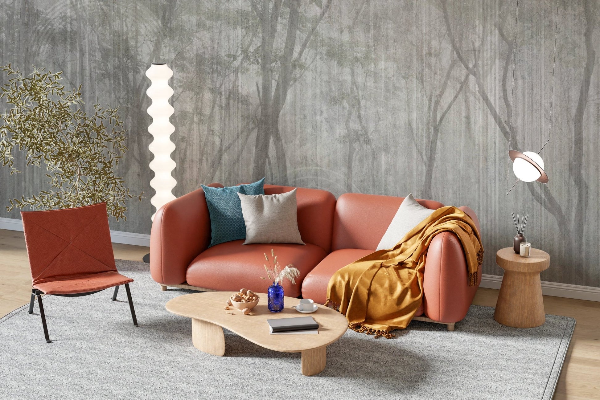 Whispers of the Woods Wall Mural behind a tan leather sofa and orange armchair.