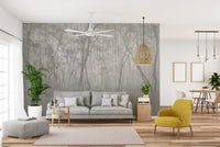 Modern living space with grey wood forest wall mural and a yellow accent chair.