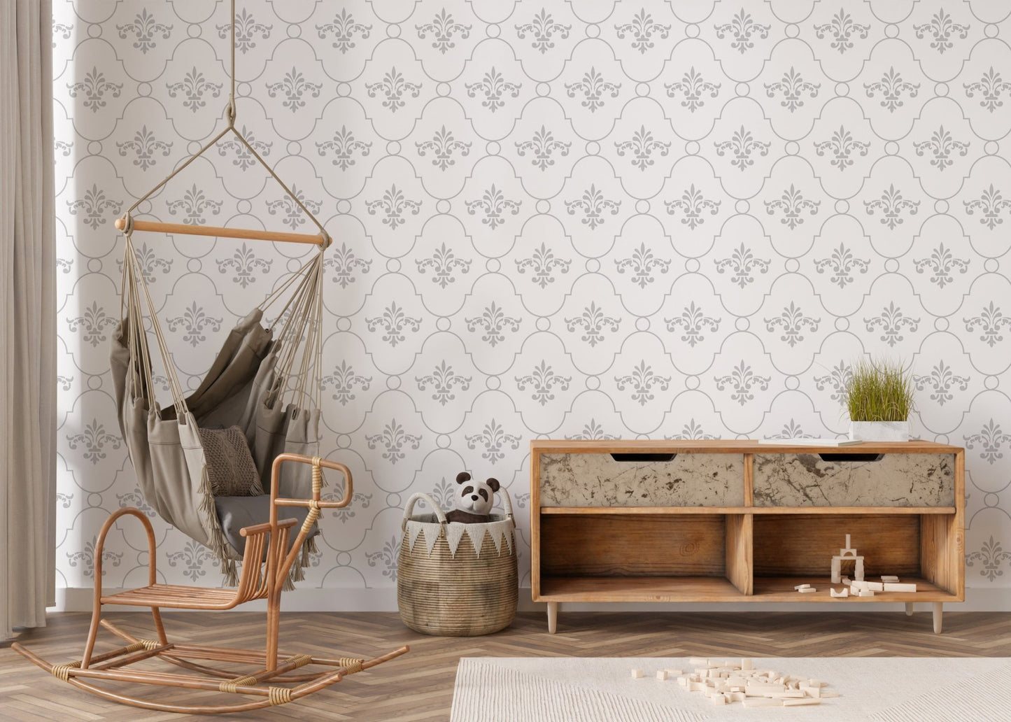 Damask wallpaper in a nursery room with a hanging chair and wooden toy chest.