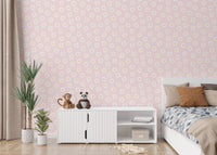 Kids bedroom setting with white cosmos flower pink background wallpaper and a crib.