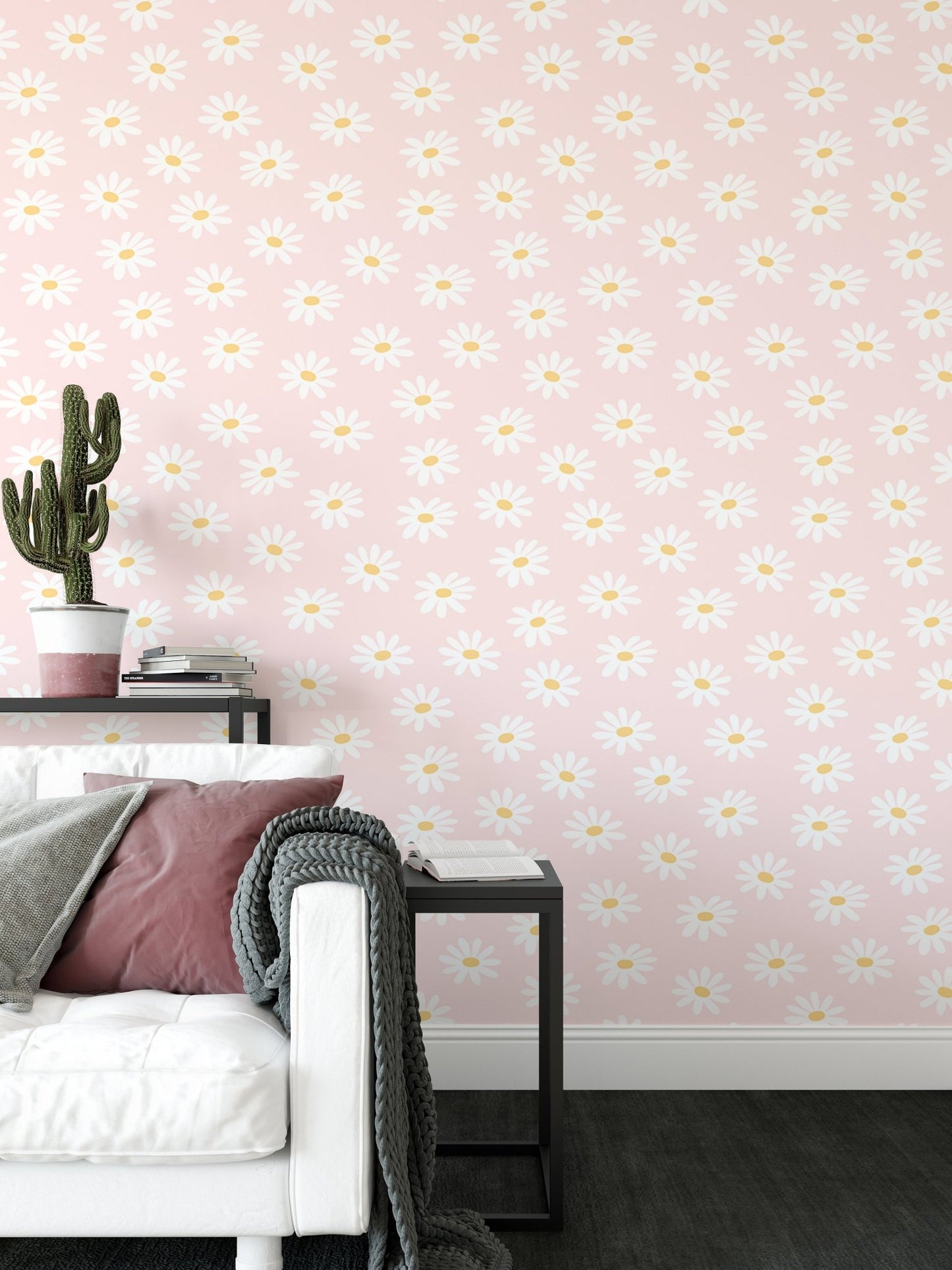 Living room corner with a white sofa and pink flower pattern wallpaper.