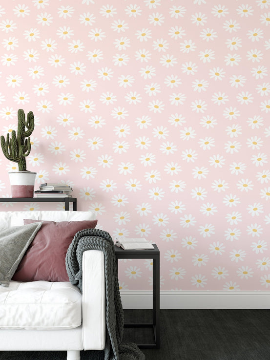 Living room corner with a white sofa and pink flower pattern wallpaper.