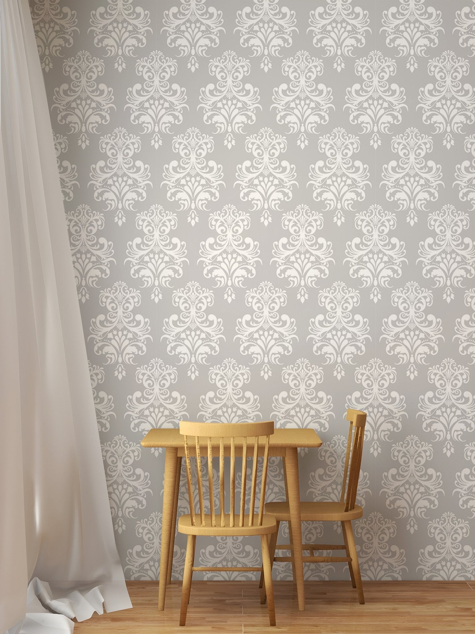 Damask pattern wallpaper in a dining area with a wooden table and chairs.