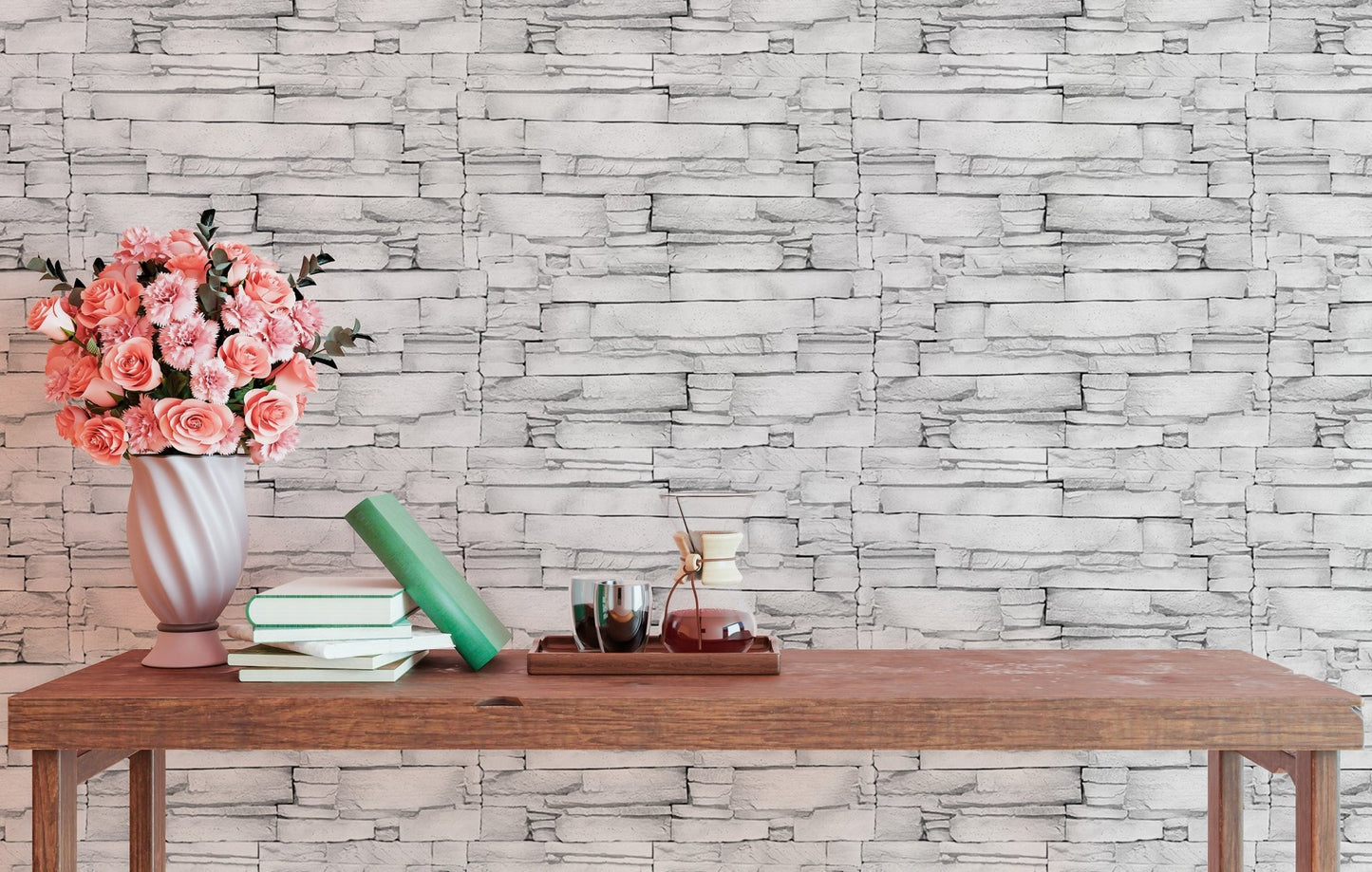 Horizontal stone block wallpaper behind a dark wood table with flowers.