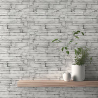 White limestone wallpaper on a feature wall with a floating wooden shelf.