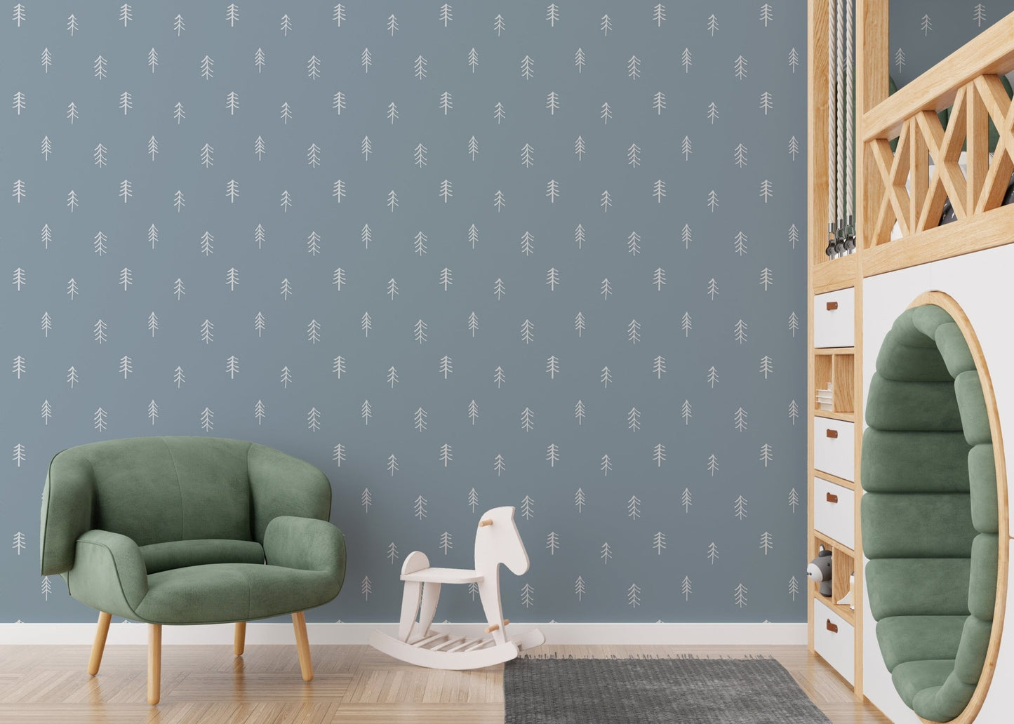 Kids room wallpaper with white tree print near green chair and toy horse.