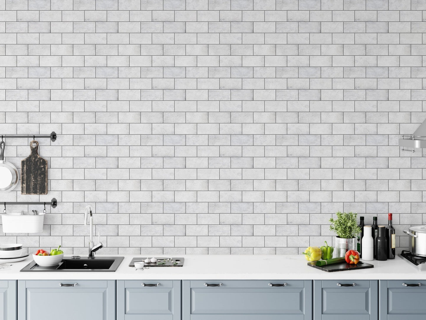 Kitchen backsplash area featuring frost white brick peel and stick wallpaper.