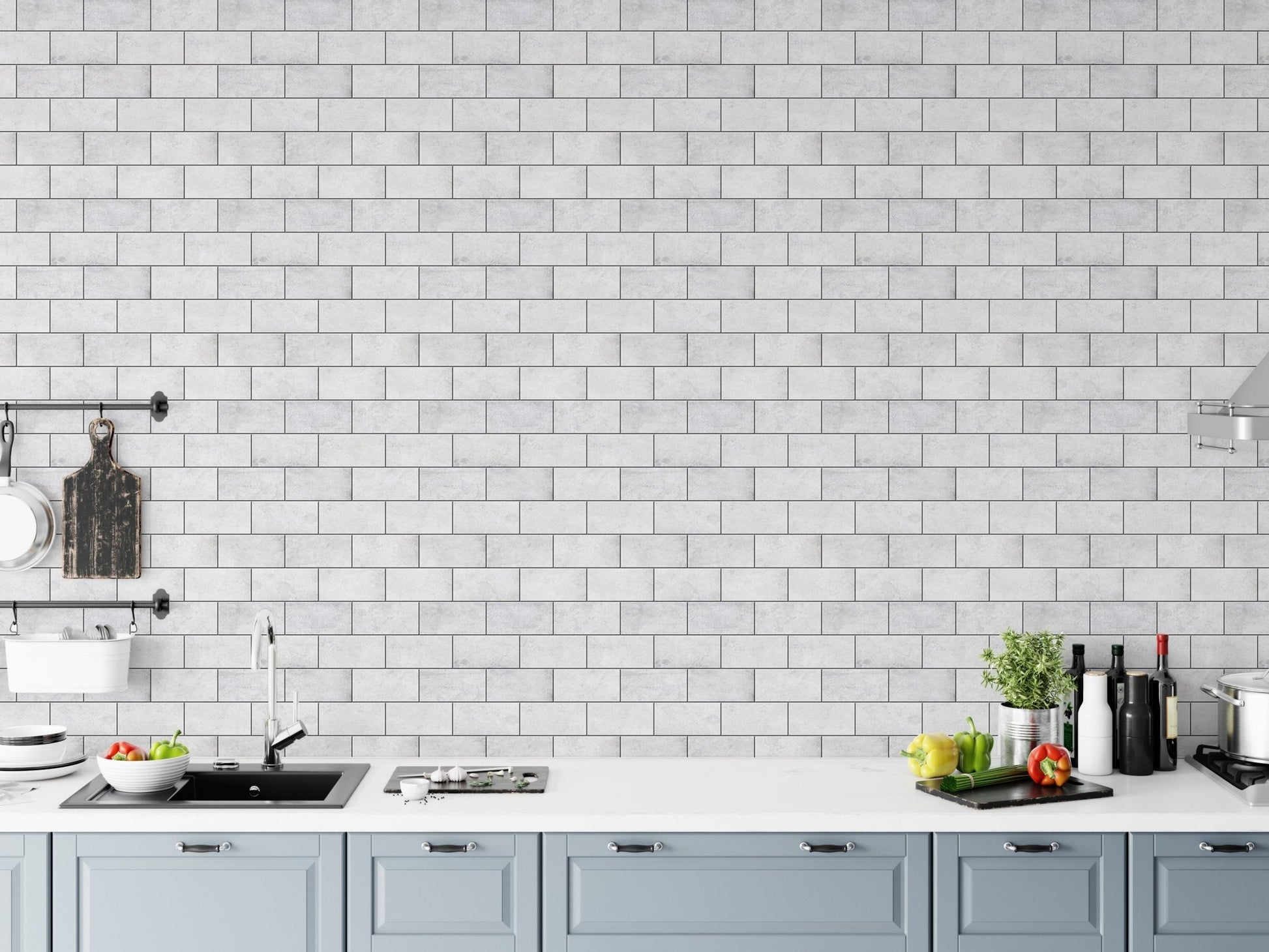 Kitchen backsplash area featuring frost white brick peel and stick wallpaper.