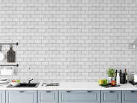 Kitchen backsplash area featuring frost white brick peel and stick wallpaper.