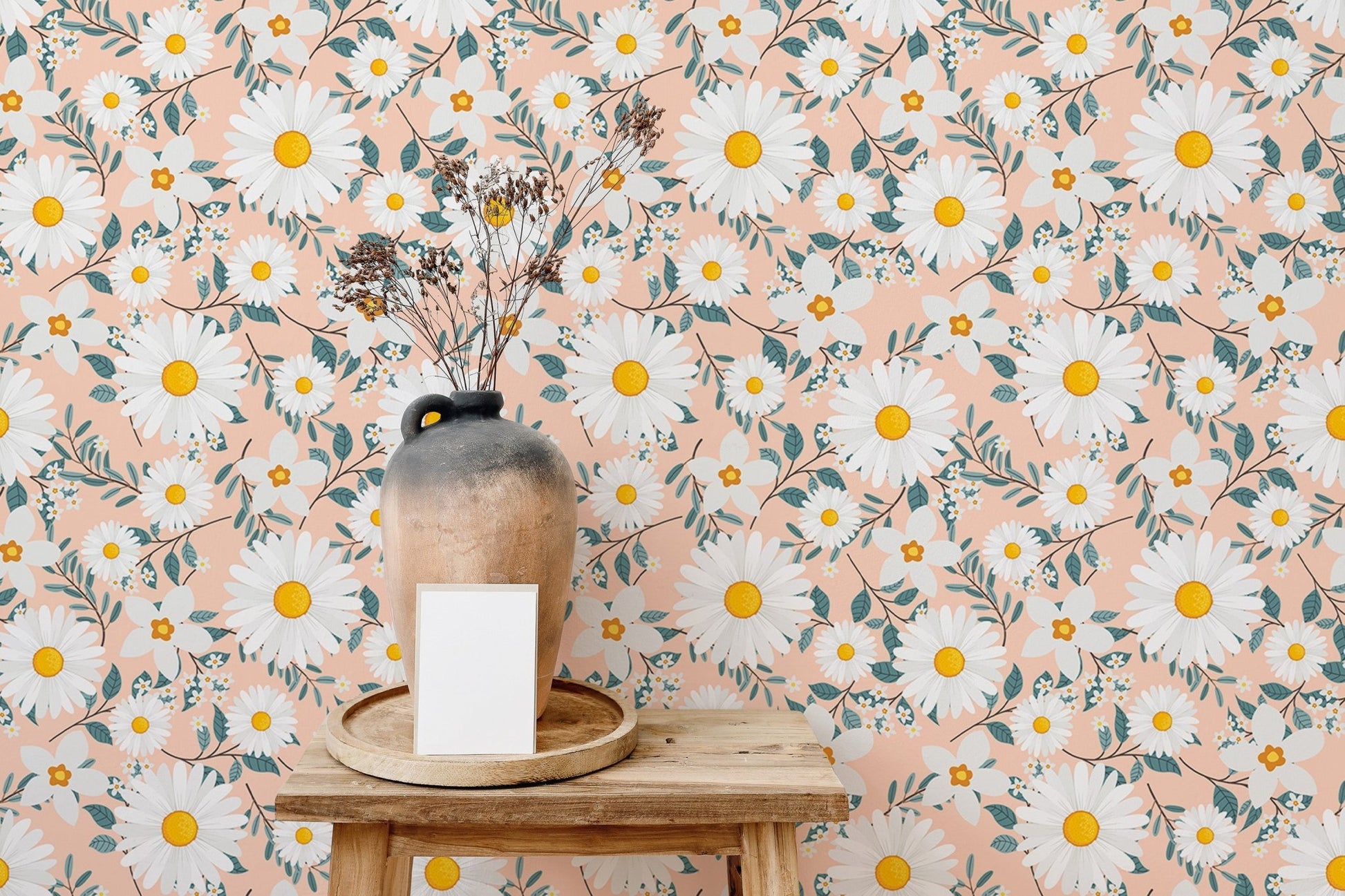 Floral branch wallpaper in a room with a wooden table and vase.