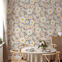 Peach floral wallpaper with white daisies in a minimalist dining space.