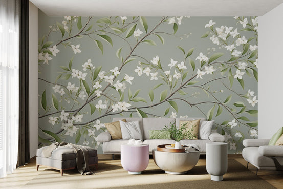 White floral branch wallpaper with delicate jasmine blossoms on a sage grey base.
