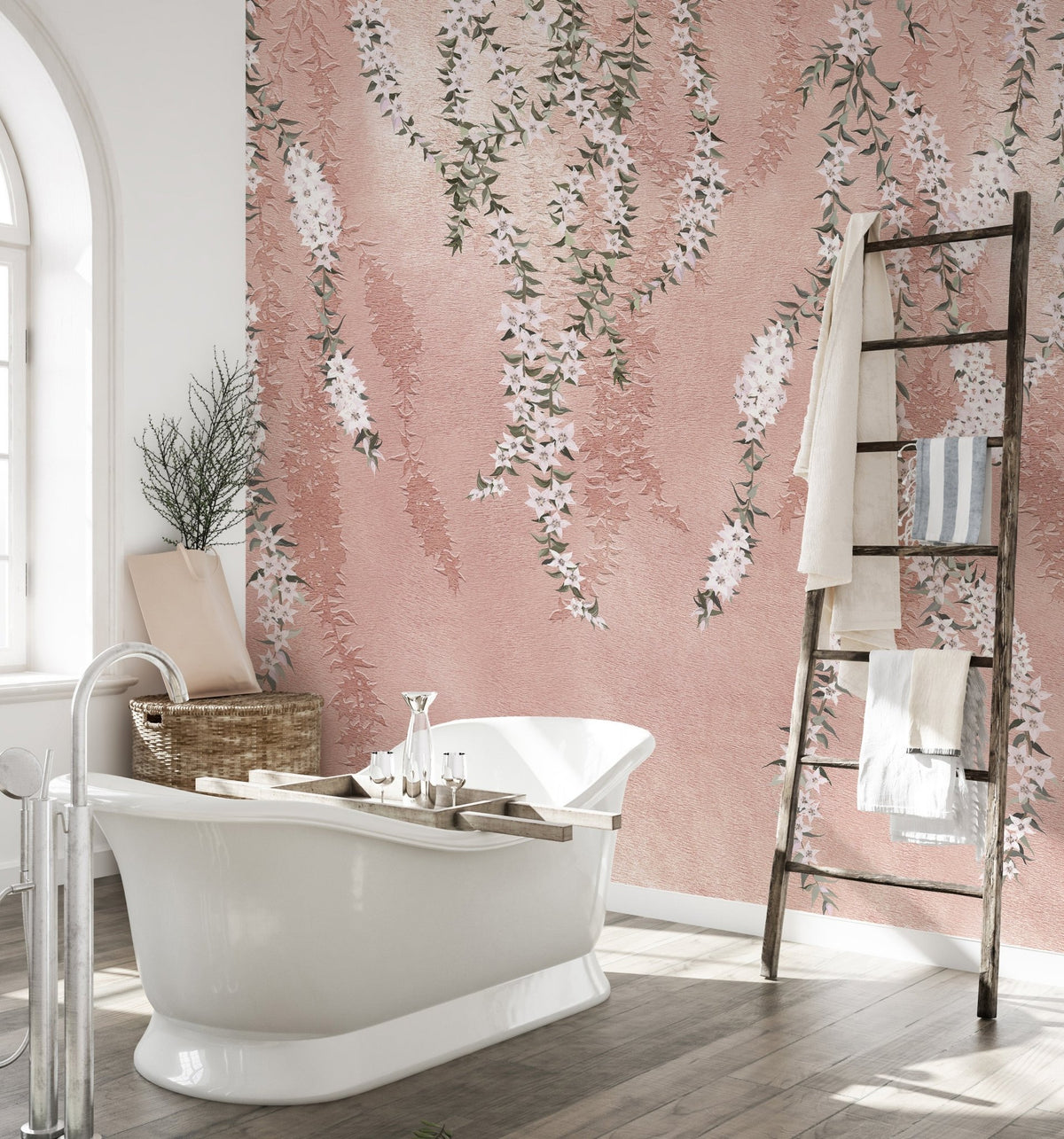 Freestanding tub in a bathroom with white orchid flower wall mural.