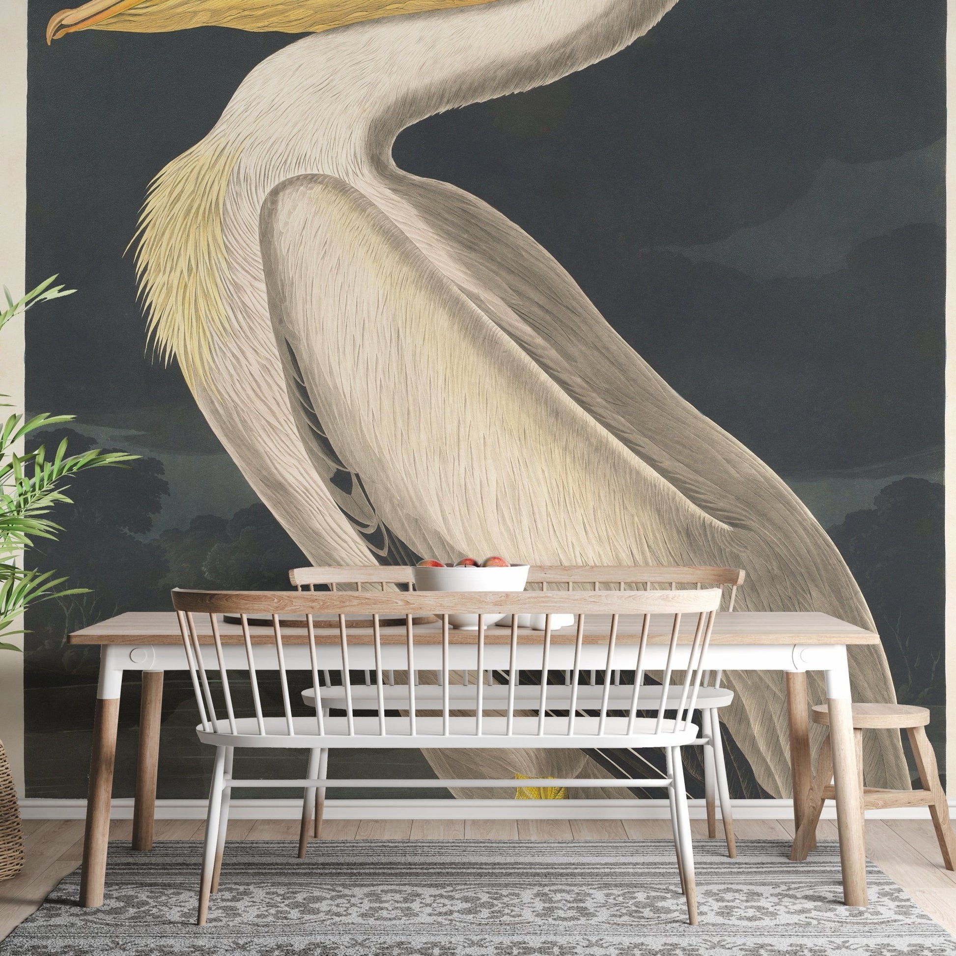Dining room wall mural showing a large pelican illustration and wooden table.