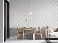 Minimalist dining area featuring white damask pattern wallpaper and hanging light.