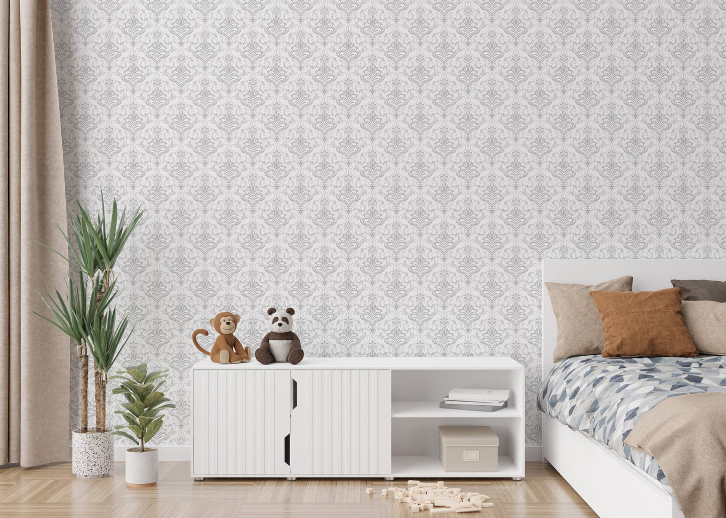 Kids room featuring damask wallpaper behind a white cabinet and toys.