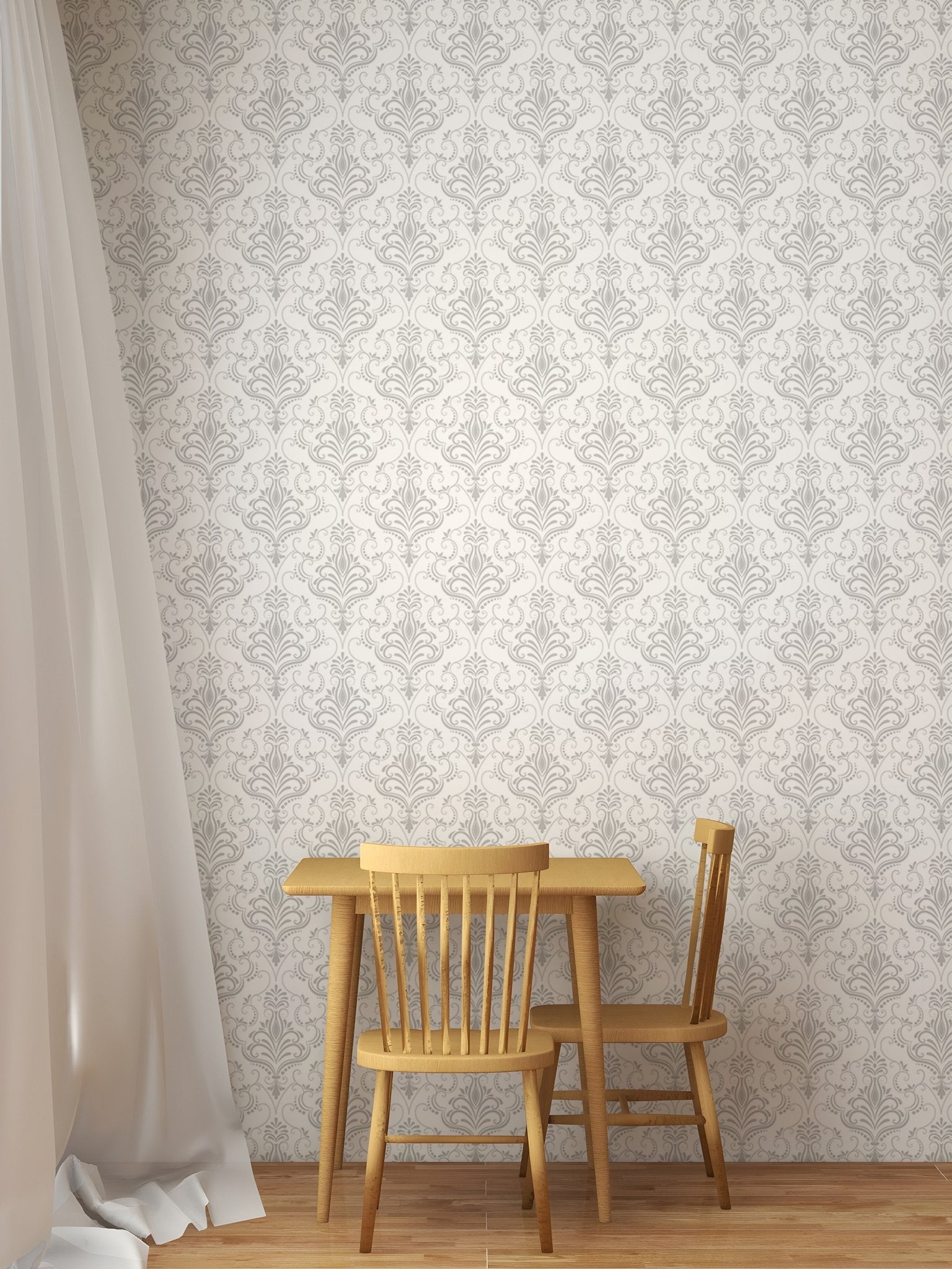 Grey floral damask removable wallpaper behind a small wooden dining table.