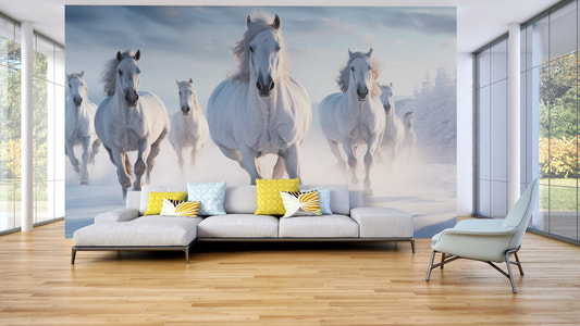 Galloping white stallions in snow wallpaper with soft blue sky.