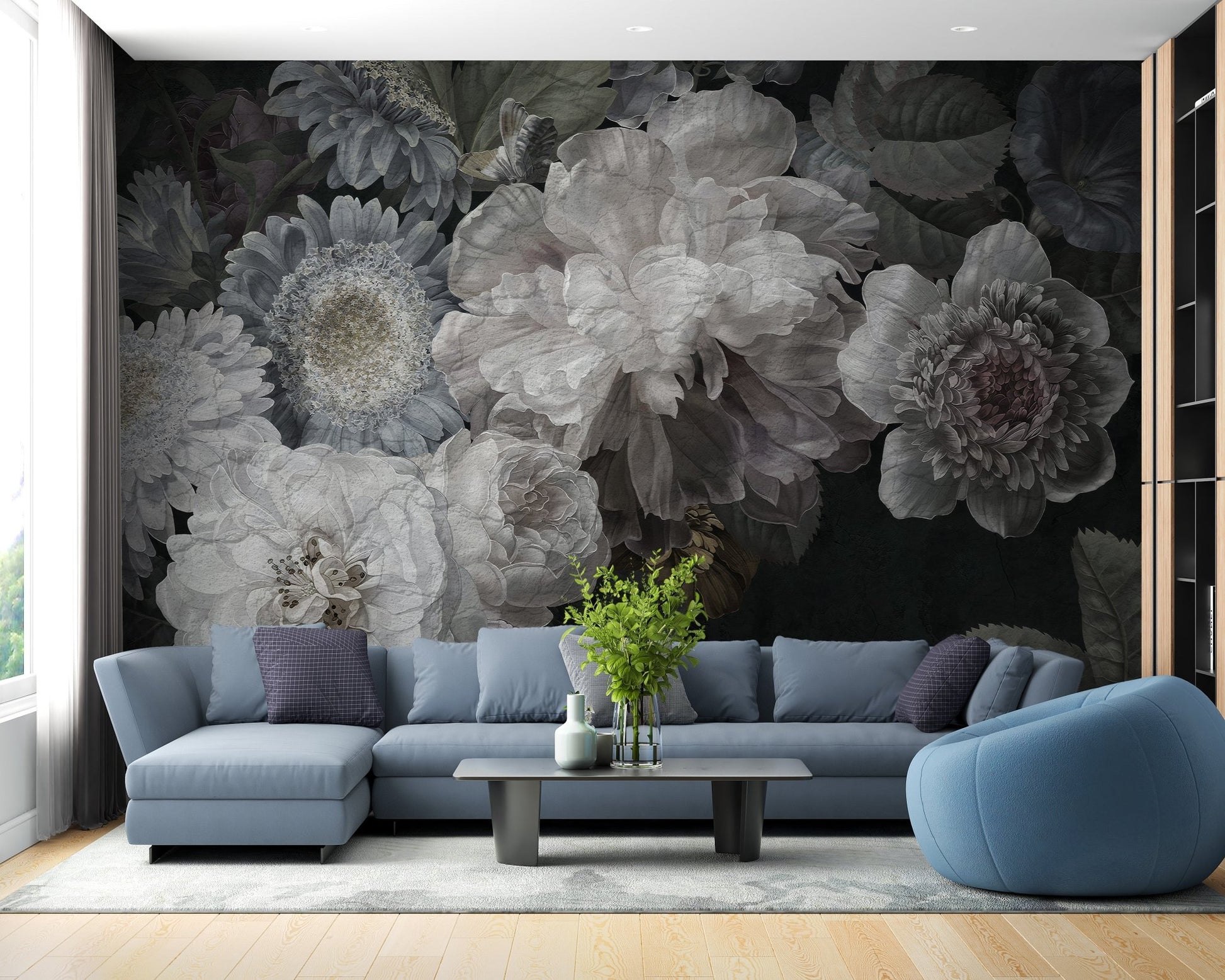 Grey toned wildflower wall mural behind a blue sectional sofa.