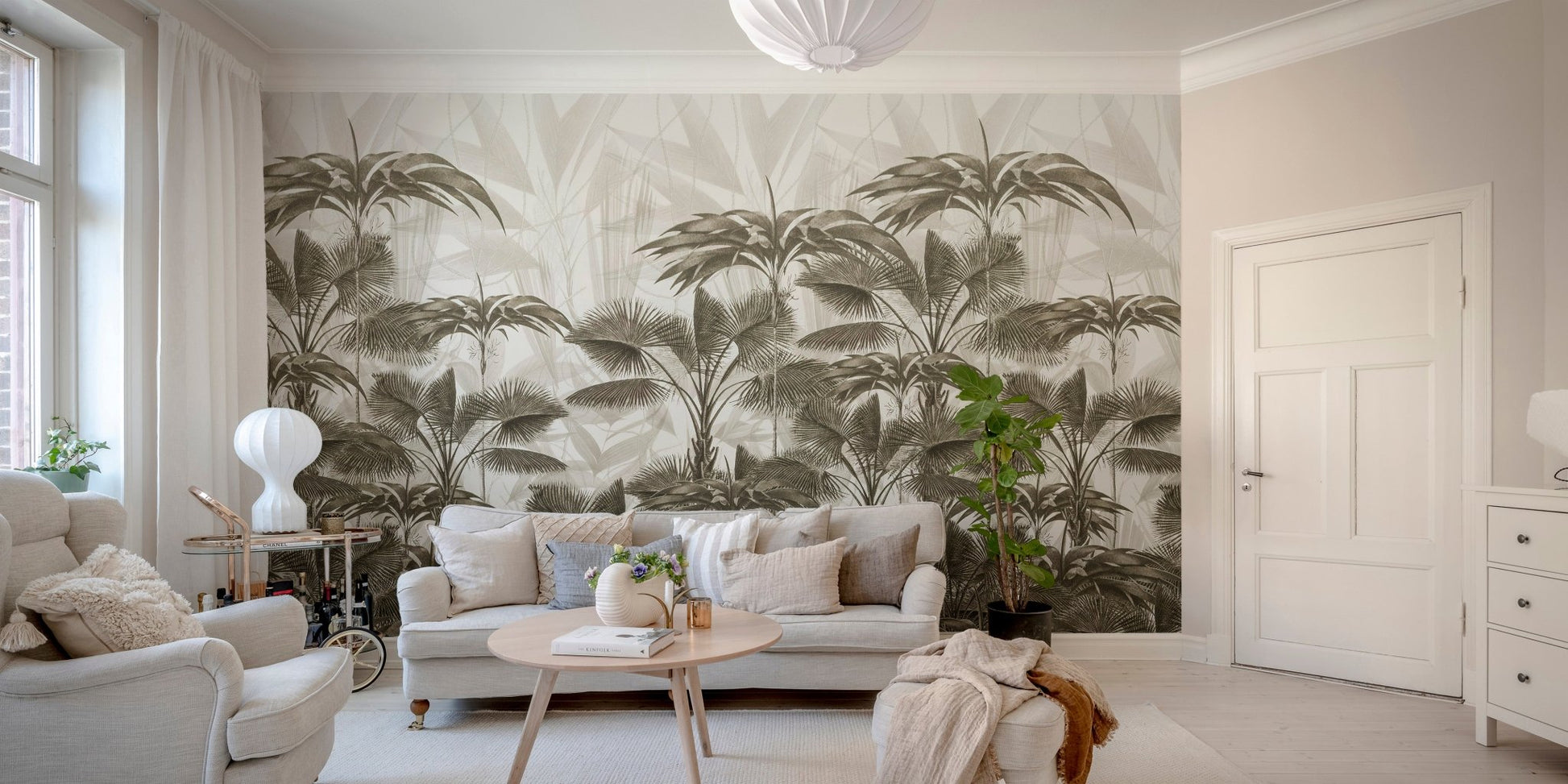 Living room sofa facing a large scale vintage palm tree wall mural.