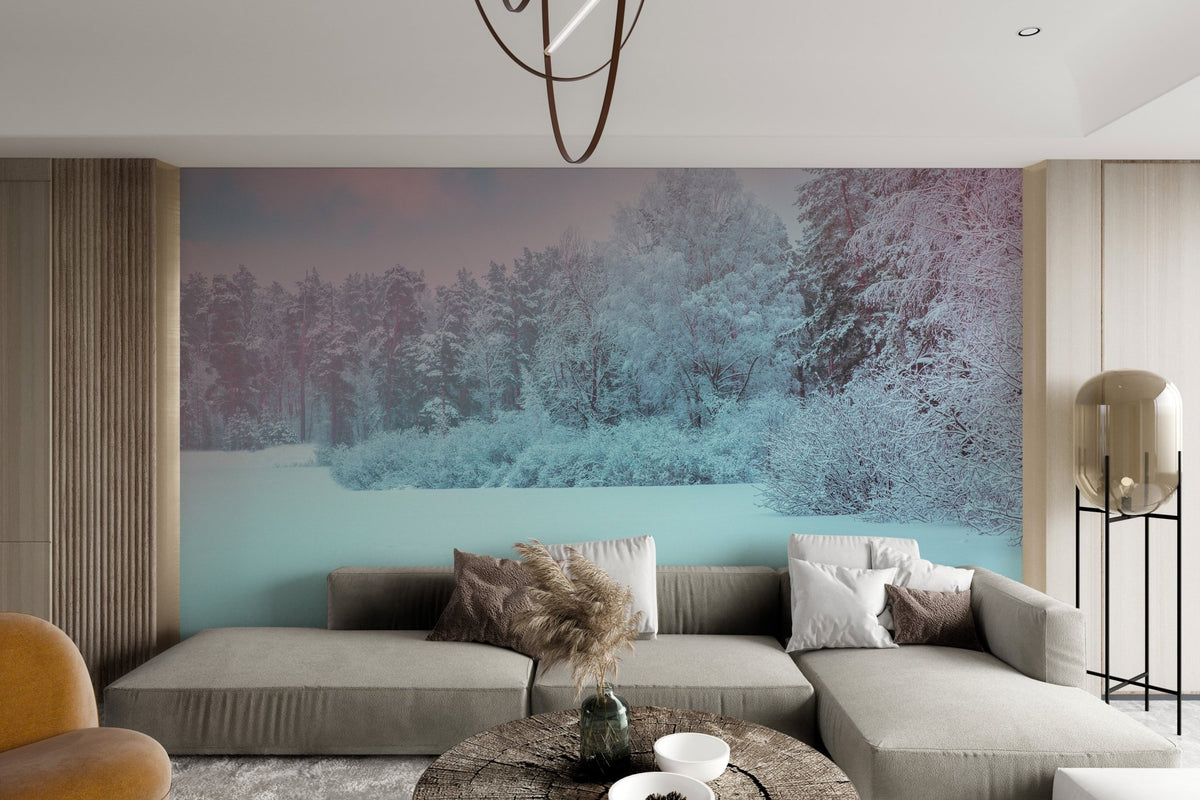 Scenic landscape wallpaper showing a wide snowy field leading into a thick winter forest.