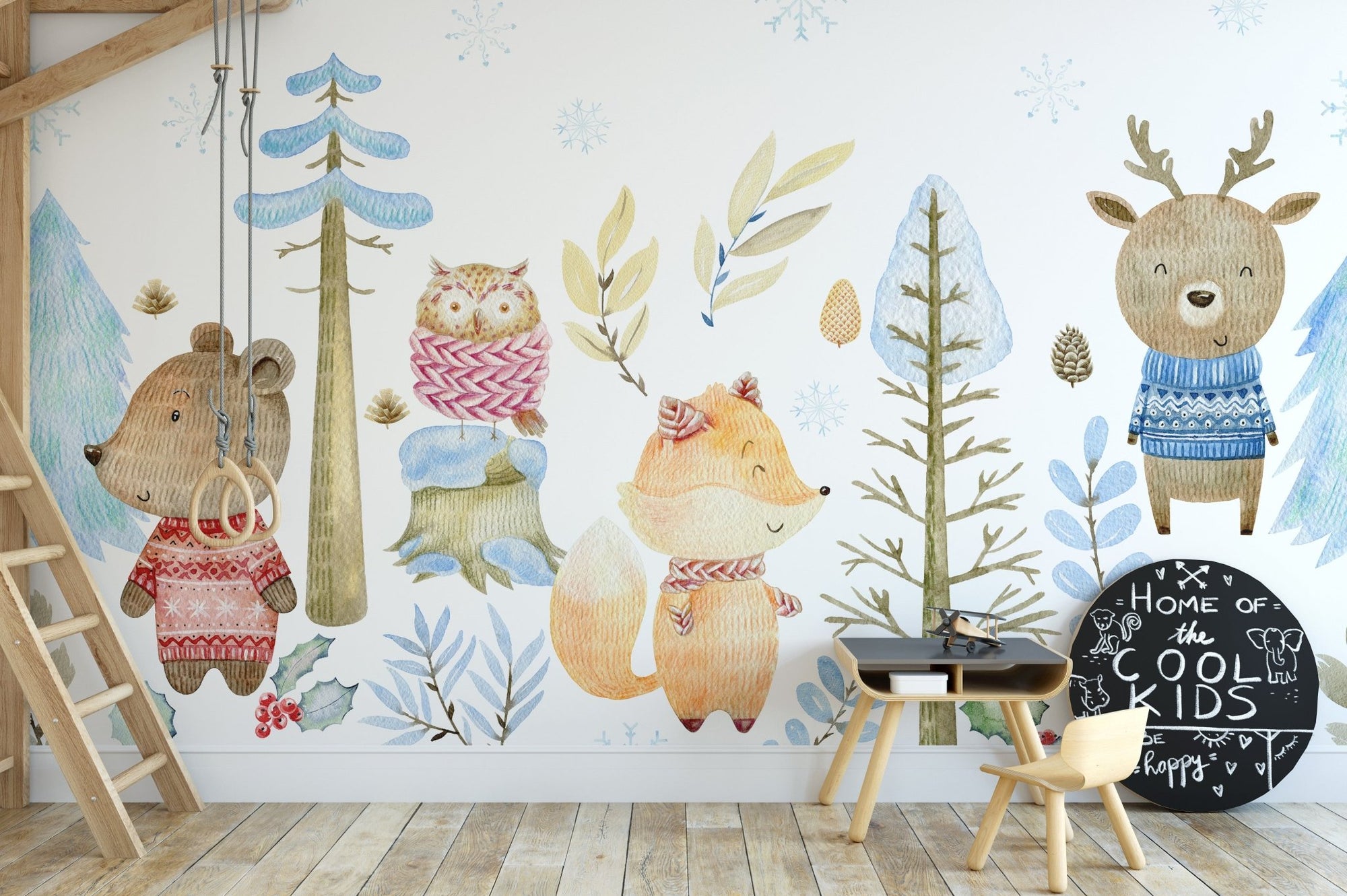 Enchanting winter wonderland mural featuring serene wildlife in kids room.
